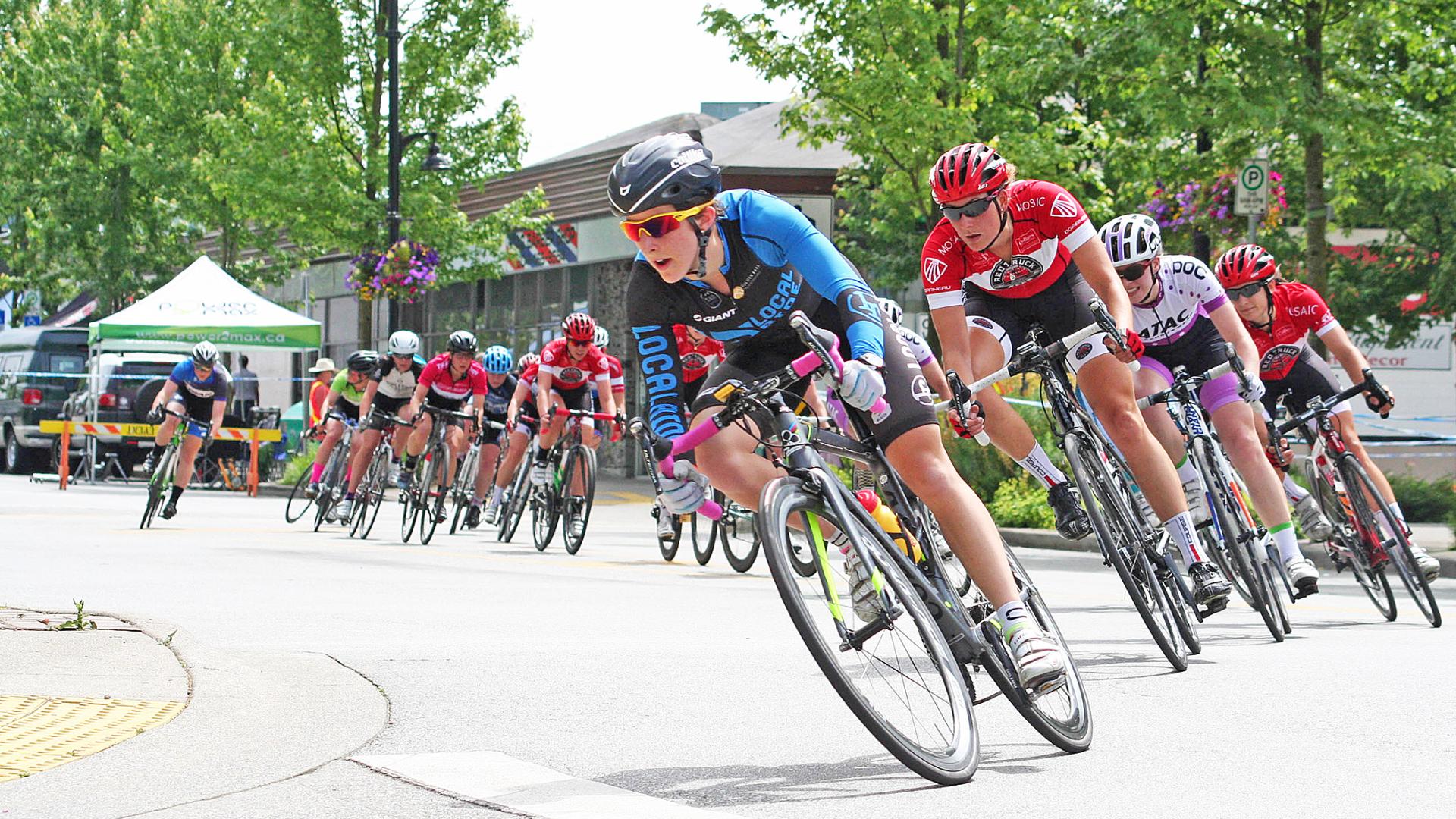 Maggie Coles-Lyster leads the pack in a road bike race.